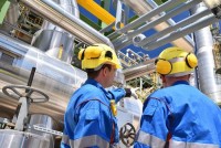 Workers in front of pipeline Industry, chemical industry, plant construction